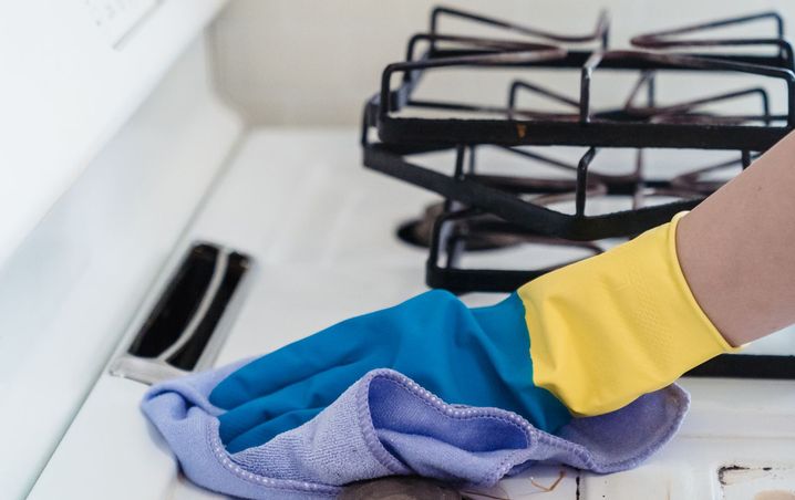 Gas stovetop wiped clean with a microfiber cloth